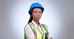 Face, serious woman and engineering in studio for construction, logistics management or industrial development on grey background. Portrait, african technician and safety contractor with arms crossed