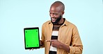 Tablet mock up, green screen and pointing in studio with website, internet and social network. Hand, ui and a happy black man with technology tracking markers, advertising or app on blue background