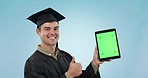 Graduate student, thumbs up and tablet green screen or presentation for college or e learning in studio. Face of man on graduation, digital mockup and ok emoji with tracking marker on blue background