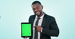 Business man, green screen and pointing at tablet mockup in studio for website and blue background. Professional black person portrait with technology tracking markers, ux advertising or app review