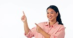 Happy asian woman, pointing and advertising list in marketing or branding against a studio background. Portrait of female person smile showing notification, good deal or sale discount on mockup space