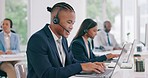 Call center, black man talking and typing on laptop, telemarketing and contact us for support at crm help desk. Happy customer service consultant on computer, sales agent and business professional. 