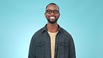 Happy, smile and face of black man in a studio with confident, good and positive attitude. Pride, casual fashion and portrait of young African male model with trendy style isolated by blue background