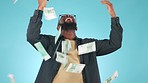 Black man, cash rain and finance, happy with winning or bonus, reward and wealth isolated on blue background. Money, success and financial freedom with prize, cashback and lotto winner in studio