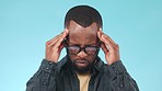 Black man, headache and pain, massage temple with stress or burnout in studio on blue background. Migraine, tension and brain fog with mockup space, hurt and life crisis with vertigo and fatigue