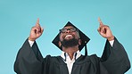 Graduation, gratitude or happy student pointing up in education, college or university presentation. Thank you, face or black man graduate in studio for success or goal achievement on blue background