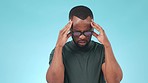 Stress, headache and young black man in a studio with sickness, allergies and mental health. Burn out, migraine and African male model with frustration, mistake or fail by isolated blue background.