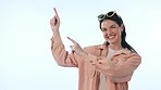 Pointing, happy and face of woman in a studio with mockup space for marketing or advertising. Smile, mock up and portrait of young female model from Canada with show hand gesture by white background.