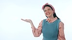 Option, smile and face of woman in a studio with mockup space for marketing or advertising. Happy, mock up and portrait of young female model from Canada with show hand gesture by white background.