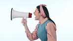 Screaming, megaphone and angry woman protest in studio, communication or announcement of news. Loudspeaker, person shouting and speech for propaganda or voice isolated on blue background mockup space