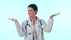 Healthcare, smile and doctor choice with a woman in studio on a blue background for a decision on options. Portrait, medical offer and palm with a happy young medicine professional showing space