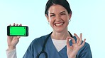 Green screen smartphone, happy woman or nurse ok, point or advertising healthcare brand, telehealth or news info. Cellphone mockup space, portrait or doctor okay, vote or opinion on studio background