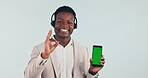 Call center, man and pointing to phone with green screen, mockup and ok mobile app for communication. Crm, businessman and portrait with hand, sign and promotion of customer service tech or software