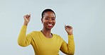 Happy, dance and music with a black woman in yellow on a blue background in studio for energy. Portrait, smile and freedom with a young person moving to audio or the sound of radio streaming