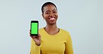 Face, woman and advertising green screen of phone, UX space or newsletter in studio on white background. Portrait of happy african model, mobile tracking markers or mockup of promotion, deal or offer