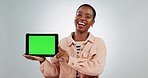 Happy, marketing and a black woman with a green screen tablet for communication, information or web. Laughing, connection and face portrait of an African person with mockup space on studio background