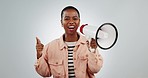 Black woman, megaphone and voice, loud support with empowerment and excited isolated on white background. Speaker, rally and revolution with power, leadership and sound, noise and speech in studio