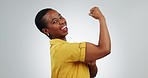 Happy black woman, flex muscle and power in studio for energy or empowerment. Portrait, strong bicep and arm of African person for hard work, smile or funny isolated on white background mockup space