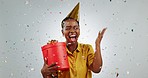 Party, confetti and woman with surprise, gift or event celebration in studio or mockup space with happiness. Happy birthday, present and portrait with prize, package or excited giveaway winner