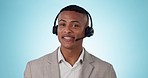 Callcenter, CRM and contact us, black man and phone call with telecom or customer service on blue background. Communication, help desk and talking for telemarketing sales and consultant in studio
