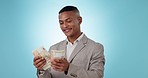 Business man, happy and counting cash in studio for financial freedom, success and lottery win. Rich, calculate money and African person with euros or prize isolated on a blue background mockup space