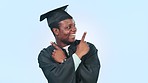 Graduate, black man and pointing for future decision, options or advertising in studio on blue background. Graduation, student and person with scholarship choice or questions for direction and smile