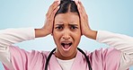 Face, doctor and woman with surprise, news and announcement on a blue studio background. Portrait, person and medical professional with shock, wow and omg with healthcare, stress and thinking