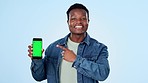 Man, phone green screen and presentation for marketing, website, fashion and news on blue background. Face of african person on mobile app mockup for contact, offer and sign up information in studio