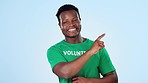 Face, volunteer and black man with opportunity, pointing and presentation on a blue studio background. Portrait, African person and model with gesture, promotion or choice with charity worker and ngo