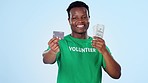 Volunteer, money and black man decision for credit card, digital cash or ecommerce for eco friendly banking. Head shake, cash and studio person volunteering for sustainable choice on blue background