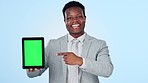 Face, green screen and black man with a tablet, employee and presentation on blue studio background. Portrait, African person or model with tech, promotion and digital app with connection or pointing