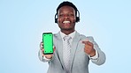 Call center, hand pointing and man face with green screen phone in studio for sign up info on blue background. Telemarketing, smartphone or portrait of consultant show contact us, platform or service