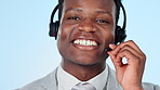 Call centre, smile and communication in studio by man, technical support and customer service. Happy black consultant, help desk and headset for crm, contact and network by blue background in mockup