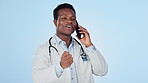 Man, doctor and phone call in studio for communication, consultation or discussion on blue background with smile. Healthcare, black person and expert with smartphone for telehealth or conversation