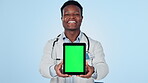 Face of doctor, green screen or black man with tablet for mockup space, ads or studio product placement. Happy, blue background or medical professional with advice for healthcare info or telehealth