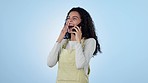 Woman, laugh and phone call in studio for conversation, communication or gossip on blue background. Happy model, mobile contact and crazy news of funny joke, social networking or cellphone discussion