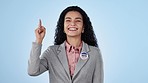 Woman, pointing up and advertising for politics and vote, election info and campaign on blue background. News, announcement and presentation, mockup and portrait with political party choice in studio