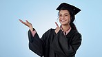 Graduate, education and face of woman with hand pointing in studio for sign up, study or checklist on blue background. University, presentation and portrait of lady student show timeline, faq or info