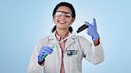 Happy, woman and doctor with vaccine, healthcare and experiment on a blue studio background. Smile, medical professional and worker with vials, test tube or science with breakthrough and development