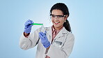Women, scientist and glass beaker for experiment, virus and analysis with liquid, chemistry and chemicals. Science, biotechnology and blue studio background for thinking, safety wear and testing
