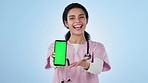Doctor, woman and phone green screen for healthcare presentation, information or advice in studio. Face of medical student or nurse with mobile app, mockup and telehealth contact on a blue background