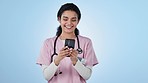 Phone, nurse and woman laugh on blue background for mobile app, online consulting and communication. Healthcare, medical service and person on smartphone for social media, internet and meme in studio