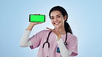 Nurse, woman and phone green screen for healthcare presentation, happy news and wow in studio. Face of medical student or doctor with mobile app, mockup and telehealth or contact on a blue background