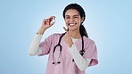 Vaccine, vial and face of woman doctor with hand pointing agreement in studio on blue background. Healthcare, medicine and portrait of happy lady nurse with yes gesture in support of Pharma treatment