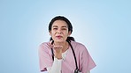Healthcare, studio and nurse with kiss, care and kindness in health, wellness and portrait. Happy woman, doctor or medical professional service with love gesture on blue background, smile and support