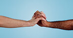 Hands, intertwined and love or support in diversity and isolated in studio by blue background. Close up of men, bonding and solidarity in collaboration for community, together and care in mockup