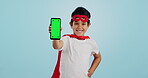Child, game and portrait with phone green screen for superhero, justice or happy mockup with ux tracking markers. Kid, super hero and smartphone with mock up space and vigilante, costume and games