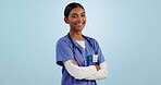 Doctor, woman and smile on face for healthcare, wellness and medicare from health insurance. Happy indian person, portrait and arms crossed with pride for career, motivation and medicine in mockup