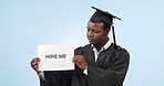 Graduation, black man and portrait with poster or confused, shrug and face for future, career or job in studio. Doubt, graduate and student with sign and dont know gesture on blue background for work