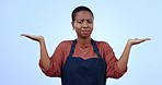 Choice, shrug and woman in studio with mockup space for marketing, promotion or advertising. Decision, balance and portrait of African female waitress with comparison hand gesture by blue background.